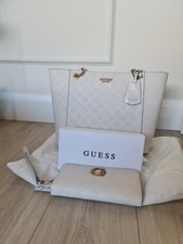 Genuine Guess cream embossed